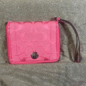 Pink Signature C Fabric wristlet wallet